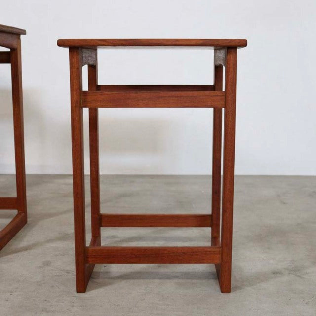 Vintage teak mid-century British nest table with clean lines, visible wood grain, and straight legs.