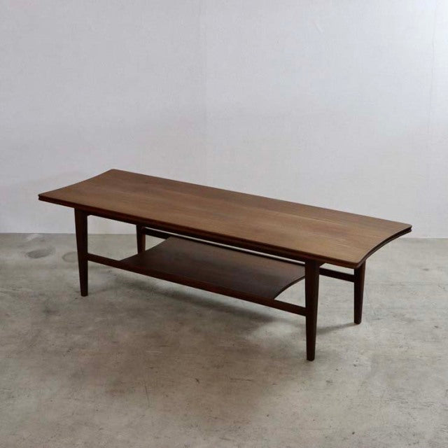 Mid-century British vintage teak coffee table by Richard Hornby with magazine rack and tapered legs.