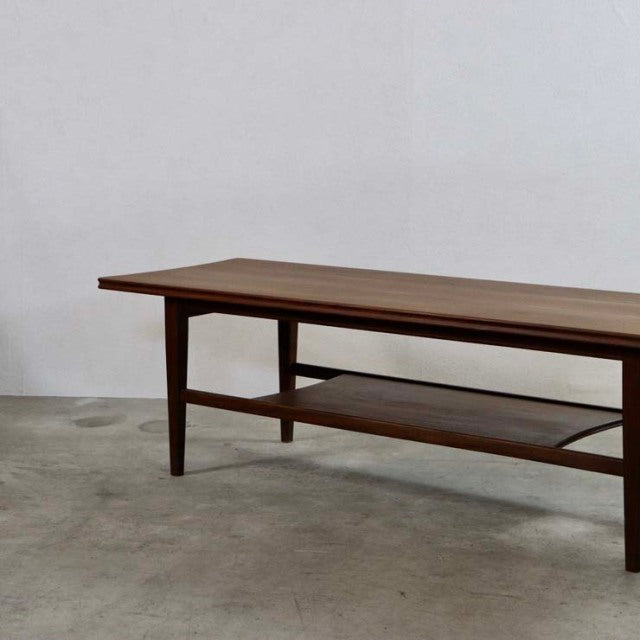Mid-century British vintage teak coffee table by Richard Hornby with magazine rack and tapered legs.
