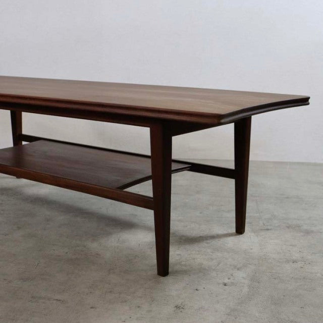 Mid-century British vintage teak coffee table by Richard Hornby with magazine rack and tapered legs.
