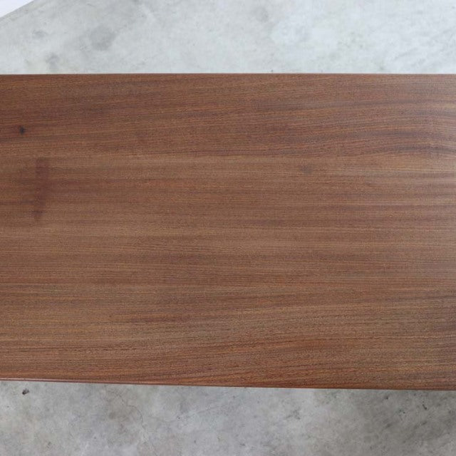 Mid-century British teak coffee table by Richard Hornby with smooth, rich wood grain and sleek rectangular top.