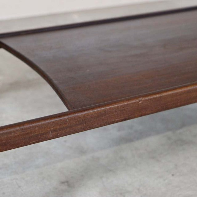 Vintage British mid-century teak coffee table by Richard Hornby with smooth wood grain and rounded corners.