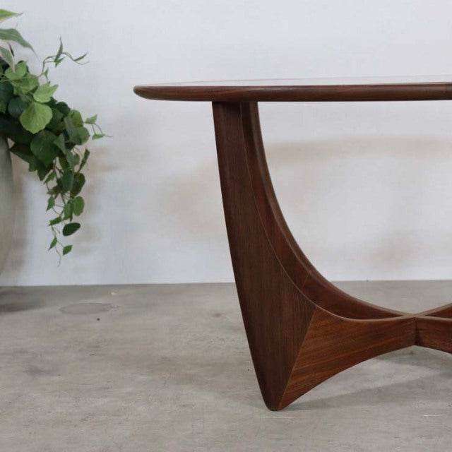 Vintage mid-century British teak coffee table by G-PLAN with sculptural curved legs and rich wood grain finish.