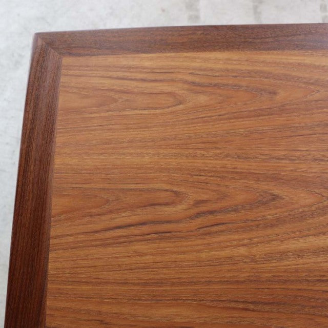 Mid-century vintage British teak dining table with rich wood grain and smooth rectangular top.