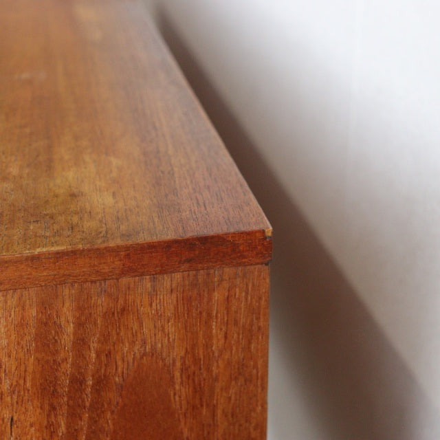 Vintage British mid-century teak sideboard by William Laurence with rich wood grain and clean edges.