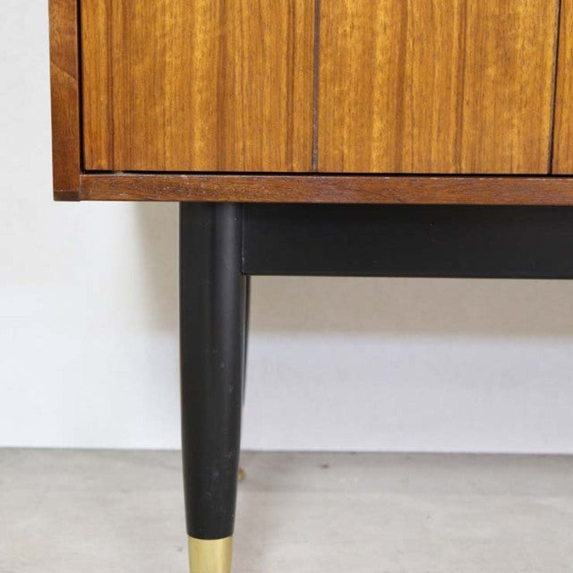 Mid-century British G-PLAN teak sideboard leg with black tapered wood and brass trim, vintage Denmark design.