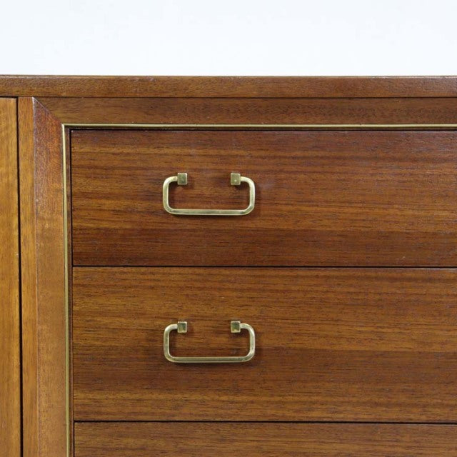 Mid-century vintage teak G-PLAN sideboard drawer detail with brass handles and rich wood grain.