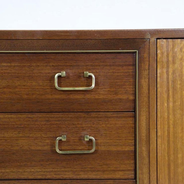Vintage mid-century teak G-PLAN Goldstamp sideboard drawers with brass handles and rich wood grain.