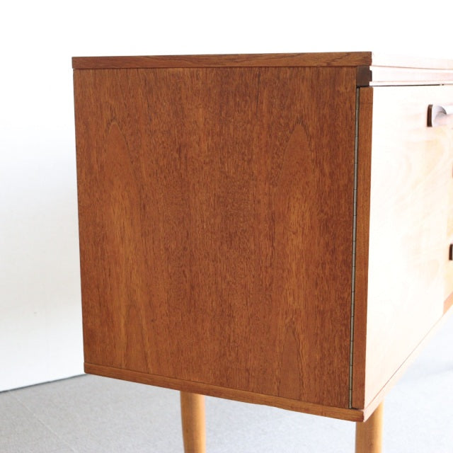 Mid-century British teak sideboard by William Laurence with rich wood grain and tapered legs, vintage Danish design.