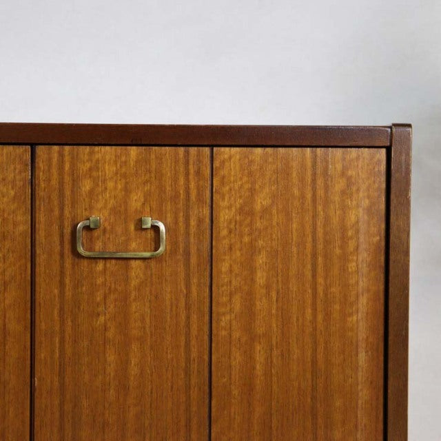 Vintage British mid-century teak sideboard door panel with rich wood grain and brass handle from G-PLAN Goldstamp.
