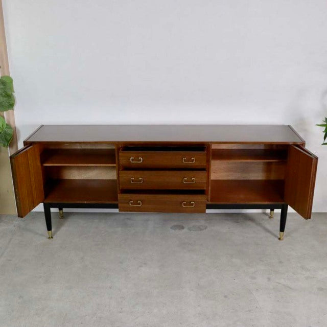 Vintage teak G-PLAN Goldstamp sideboard with mid-century British design, featuring three central drawers, two open shelving.