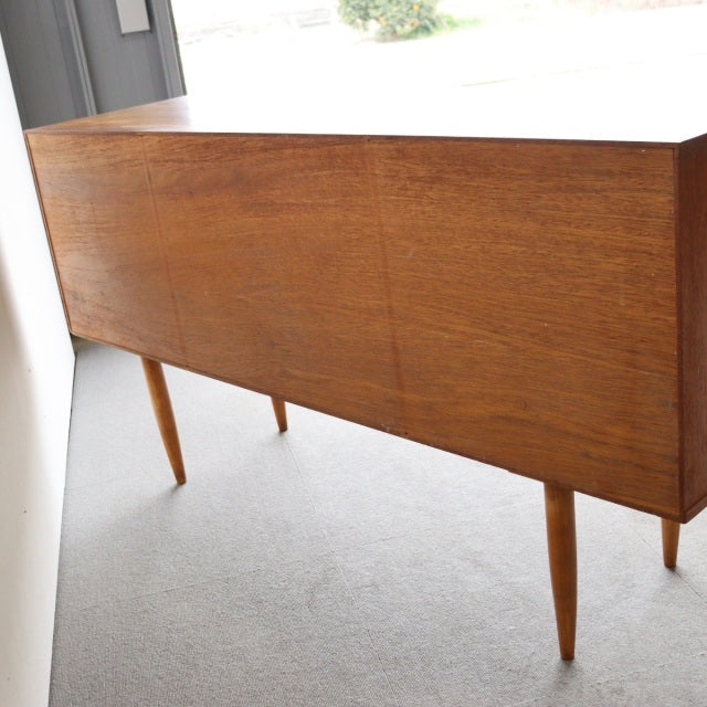 Vintage teak sideboard by William Laurence, British mid-century design with clean lines and tapered legs, smooth wood grain, .