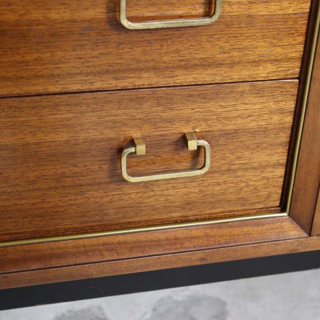 Close-up of vintage teak G-Plan drawer with brass rectangular pull, showcasing mid-century British craftsmanship and fine.