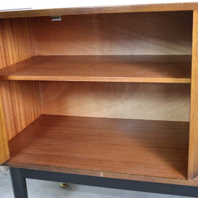 Mid-century British G-PLAN Goldstamp teak sideboard interior with rich wood grain and adjustable shelf.