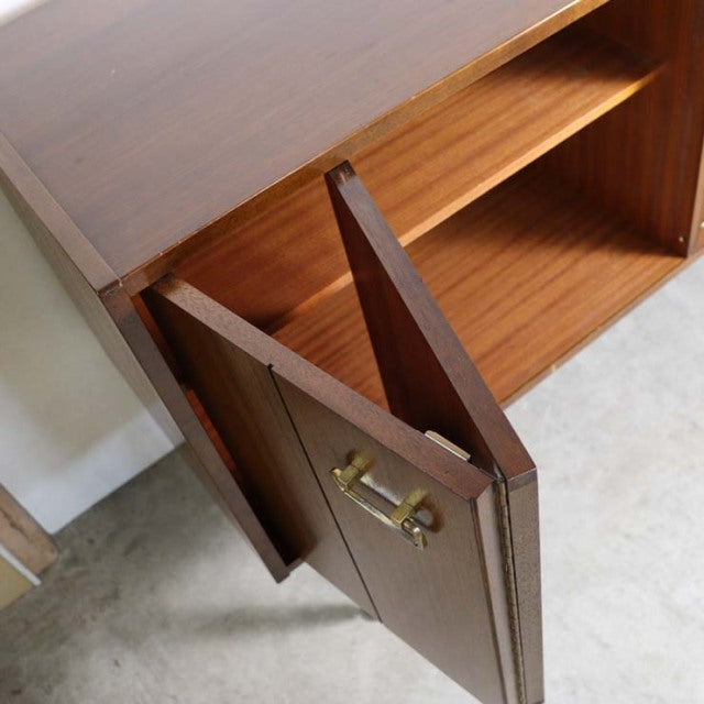 Mid-century British G-PLAN teak sideboard with rich wood grain, brass handles, and tapered legs, vintage Danish design.