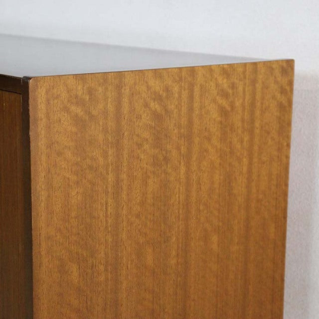 Mid-century British G-PLAN Goldstamp teak sideboard with rich wood grain and clean lines, subtle Danish design influences.