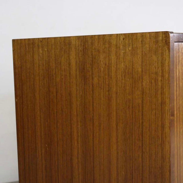 Vintage mid-century British G-Plan Goldstamp teak sideboard with rich wood grain and tapered legs.