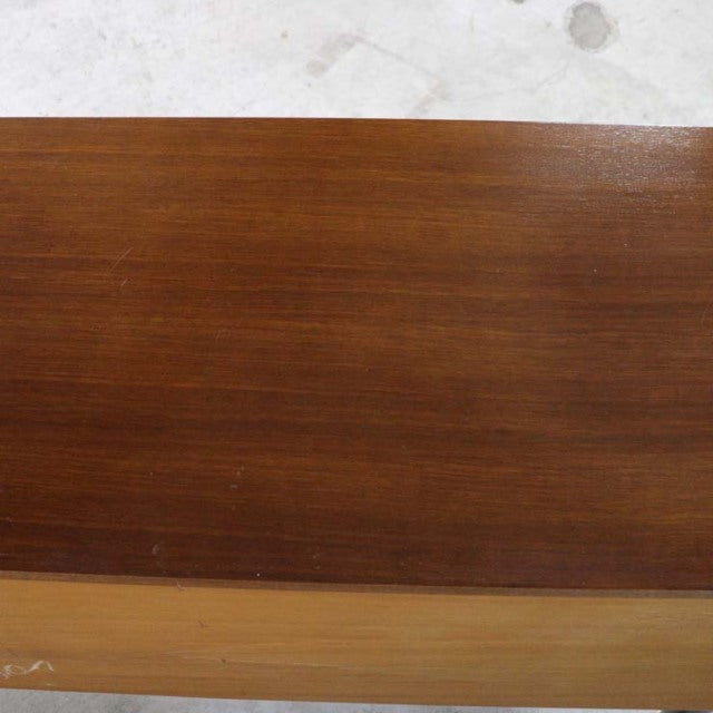 Close-up of vintage British mid-century teak sideboard top showing rich wood grain and smooth finish.