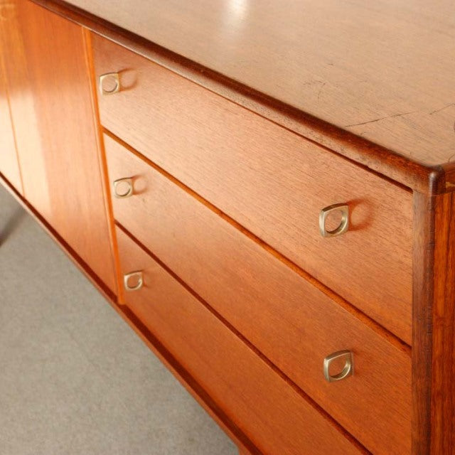 Vintage teak sideboard from Younger, British mid-century design with clean wood grain and sleek metal handles.
