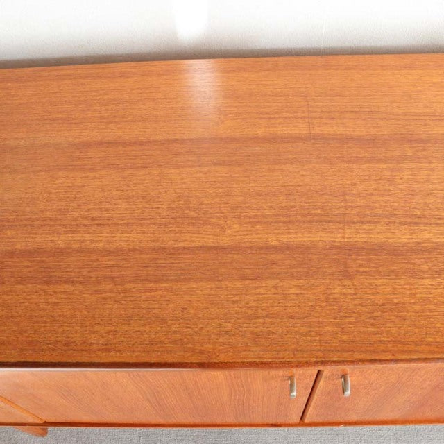 Mid-century British teak sideboard top showing rich wood grain and smooth finish from Younger brand.