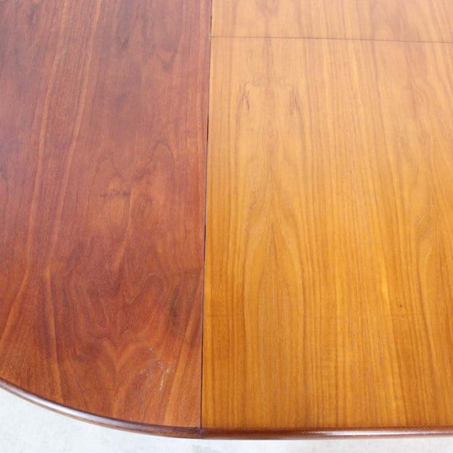Vintage teak British mid-century dining table top with rich wood grain and smooth finish.
