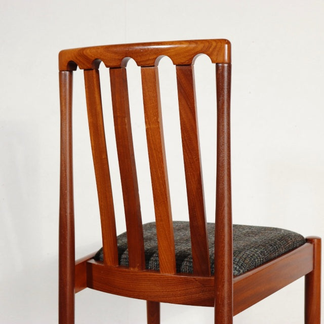 Vintage teak dining chair by MEREDEW with British mid-century design, vertical slat back and tapered legs.
