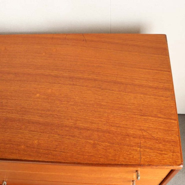 Vintage teak sideboard top with rich wood grain showcasing mid-century British and Danish design craftsmanship.