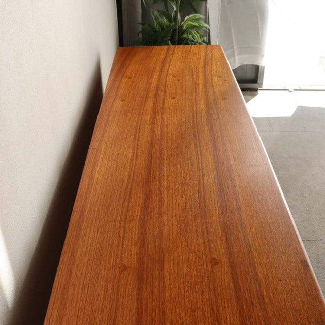 Vintage teak sideboard by Younger, British mid-century design with sleek grain and tapered legs.