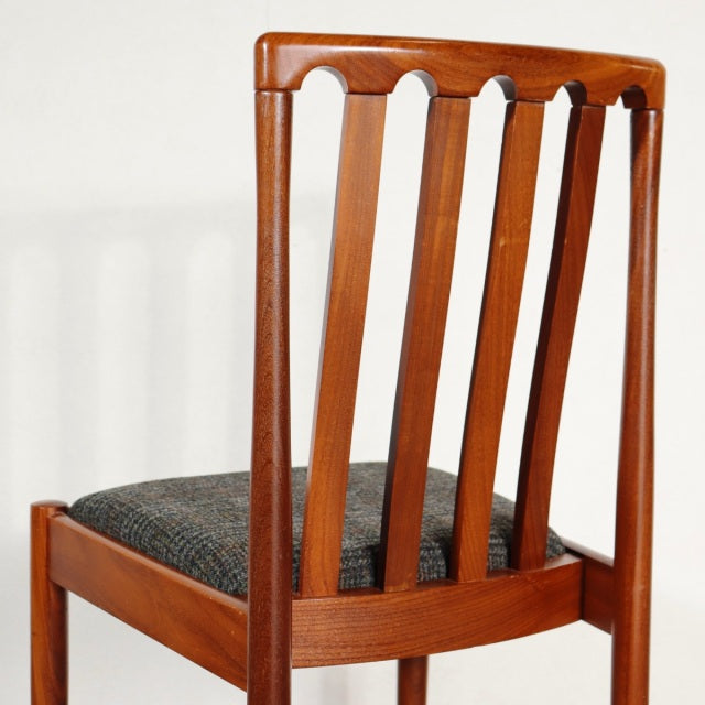 Vintage mid-century teak dining chair by MEREDEW with vertical slatted backrest and dark upholstered seat, British and.