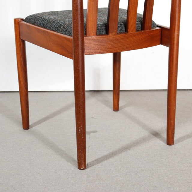 Vintage mid-century teak dining chair by Meredew with slender British-style legs and fabric seat upholstery.