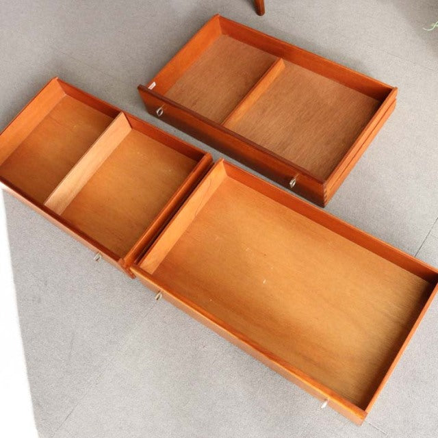 Mid-century British teak sideboard by Younger with rich wood grain, clean lines, and slender legs, showcasing open.