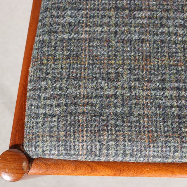 Vintage teak dining chair seat with textured British mid-century Denmark tweed upholstery and polished rounded wooden frame.