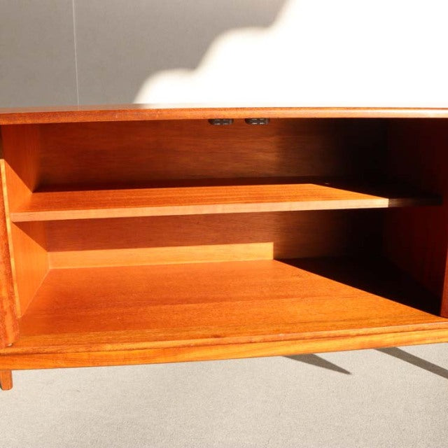 Vintage teak sideboard by Younger with mid-century British-Danish design, showing open storage and rich wood grain.