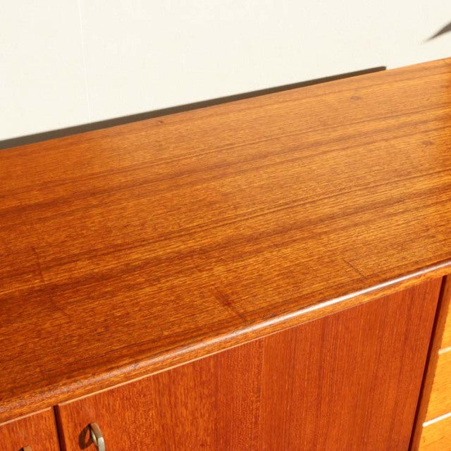 Vintage teak Younger sideboard with British mid-century design, smooth wood grain, and clean lines.