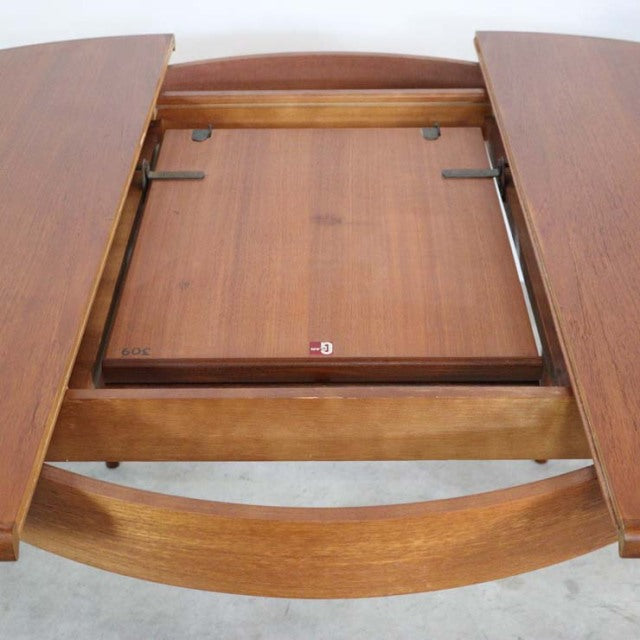 Vintage teak G-Plan mid-century British dining table extension mechanism with smooth wood grain and rounded edges.