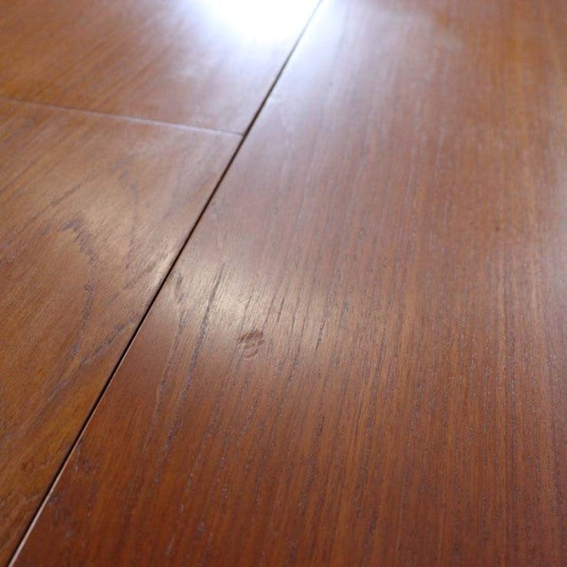 Mid-century British G-Plan teak dining table top with smooth grain and extension seam visible.