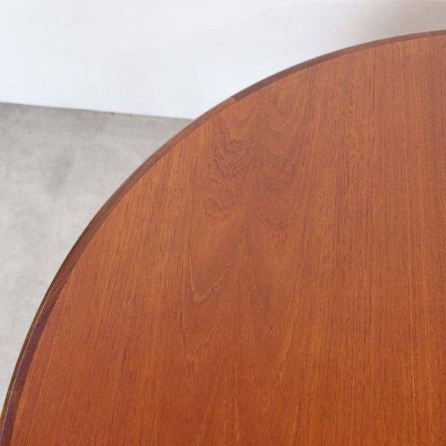 Mid-century British G-Plan vintage teak dining table with smooth oval top and warm wood grain.