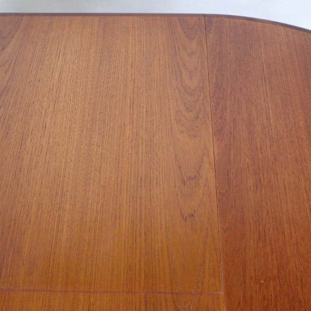 Mid-century vintage British G-Plan teak dining table top showing rich wood grain and smooth finish.
