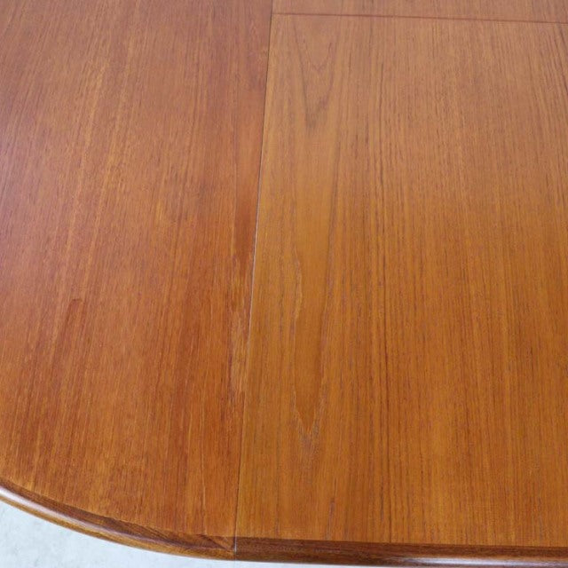Vintage teak G-Plan mid-century dining table top showing rich wood grain and extension seam.