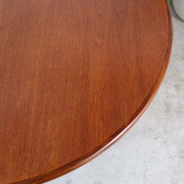 Round mid-century vintage teak dining table top with rich wood grain, smooth edges, British G-Plan design.