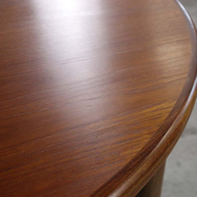 Vintage teak G-Plan dining table top with smooth rounded edge, showcasing British mid-century wood grain and craftsmanship.