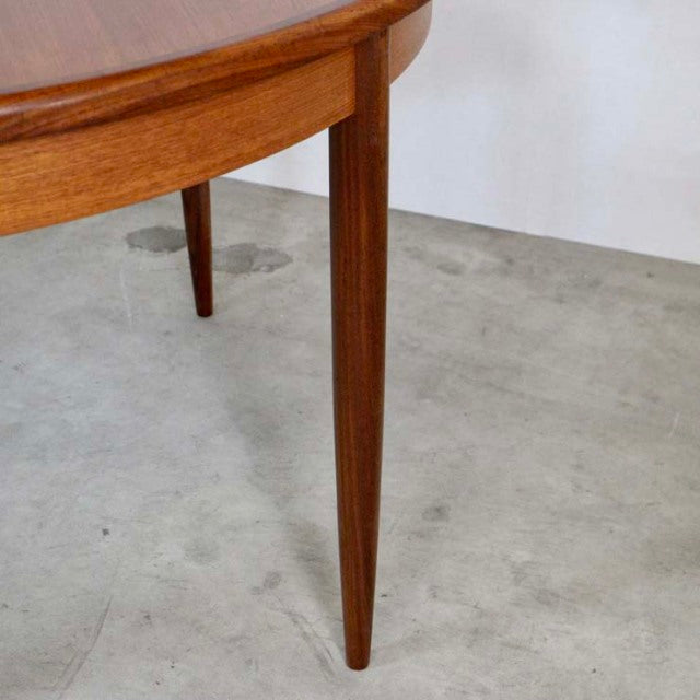 Mid-century British G-Plan dining table leg in vintage teak with tapered design and smooth wood grain.