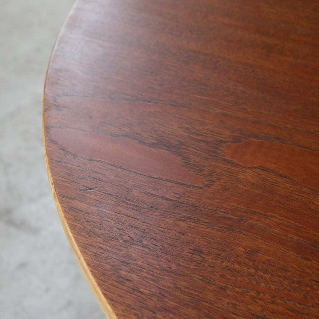 Round vintage teak dining table top showing rich wood grain and smooth mid-century finish, British-Denmark design.