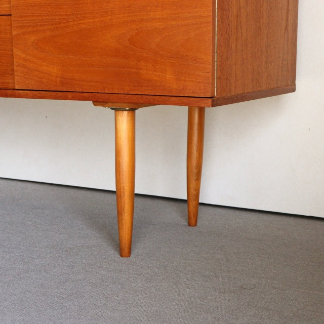 Mid-century vintage teak sideboard legs by William Laurence with smooth wood grain and tapered form.