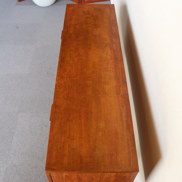 Vintage teak sideboard by William Laurence, British mid-century design with rich wood grain and slender legs, inspired by.