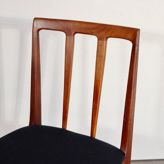 Mid-century British teak dining chair by YOUNGER with vertical slatted back and black upholstered seat.