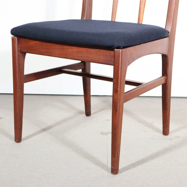 Vintage YOUNGER teak dining chair with mid-century British design, black cushioned seat, tapered legs.
