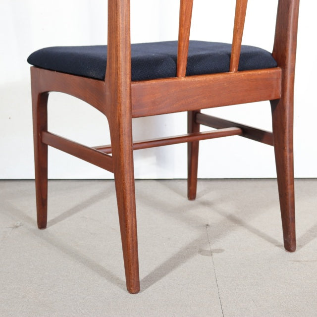 Vintage YOUNGER mid-century teak dining chair with slender legs, vertical slat back, and navy upholstered seat from.