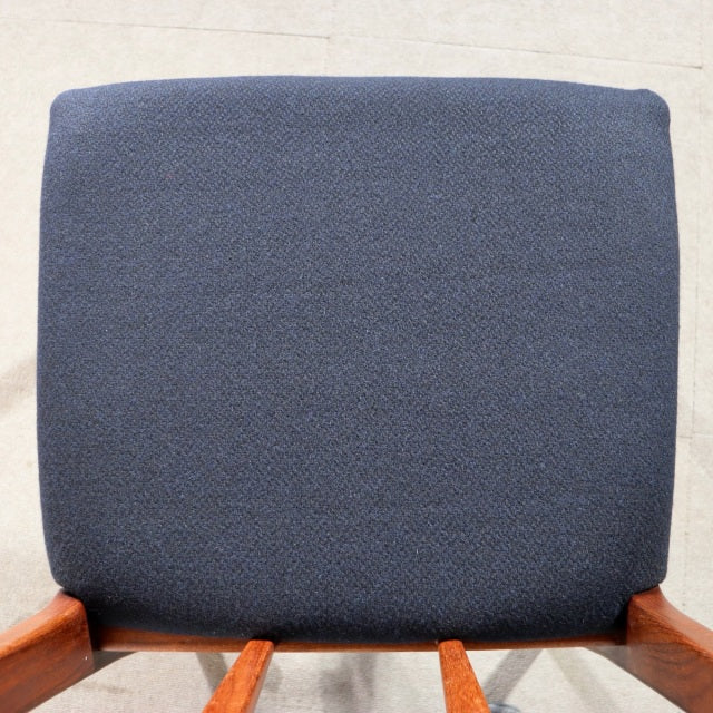 Mid-century British YOUNGER dining chair with vintage teak frame and navy blue upholstered seat back.