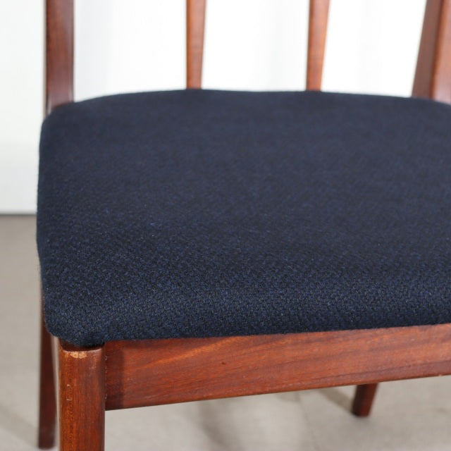 Vintage YOUNGER teak dining chair with mid-century British design, navy upholstered seat, visible wood grain and slender legs.